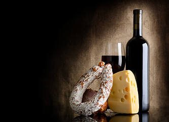 Image showing Wine bottle and cheese