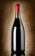 Image showing Bottle of wine on the old background