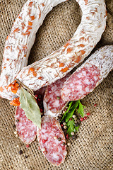 Image showing Salami sausage on a canvas