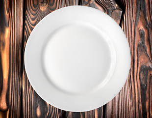 Image showing Plate on a wooden table