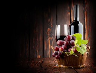 Image showing Wine on the old wooden background