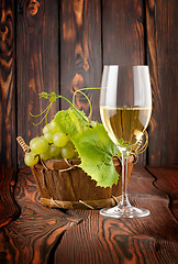 Image showing Glass of white wine and grapes
