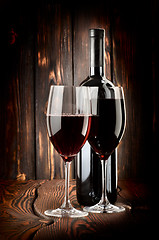 Image showing Two glasses of wine and wine bottle