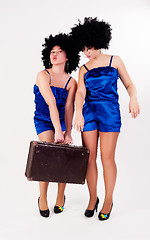 Image showing Two pretty dancers with old suitcase