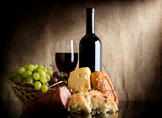 Image showing Wine bottle and food