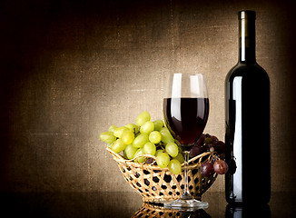 Image showing Grapes and a bottle with wine