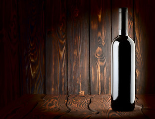 Image showing Bottle on a wooden background