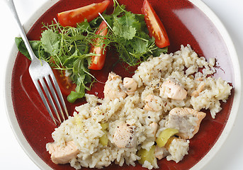 Image showing Salmon risotto and salad from above