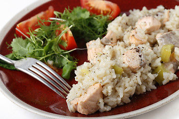 Image showing Salmon risotto close up with fork