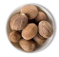 Image showing Nutmegs  in plate isolated