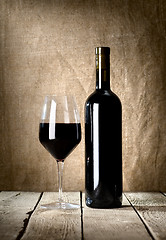 Image showing Black bottle and glass