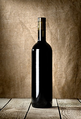 Image showing Black bottle of red wine