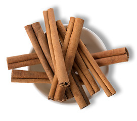 Image showing Cinnamon in plate isolated