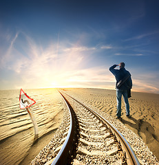 Image showing Man and railway in desert