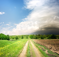 Image showing Country road and storm clouds