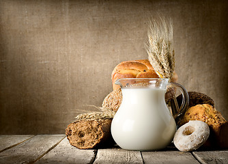 Image showing Milk and bread on canvas