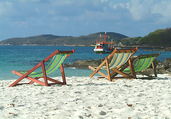 Image showing Three chairs on the beach