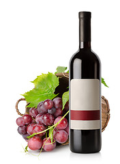 Image showing Wine bottle and grape in basket