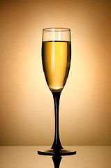 Image showing Wineglass  over gold background
