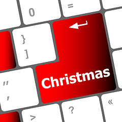 Image showing christmas button on the keyboard key - holiday concept