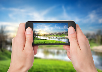 Image showing Phone and spring landscape