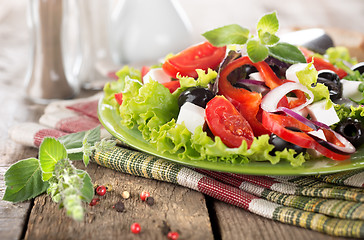Image showing Vegetable salad on a wooden table