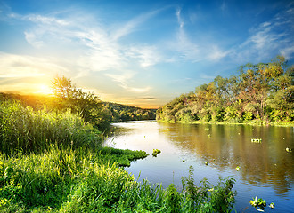 Image showing Sunrise over the forest river