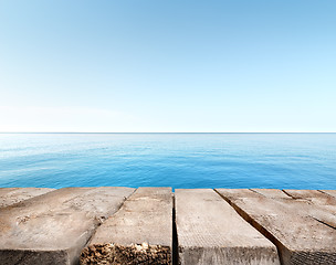 Image showing Blue sea and wooden pier