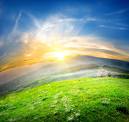 Image showing Green meadows and mountains