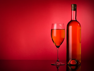 Image showing White wine on a red background