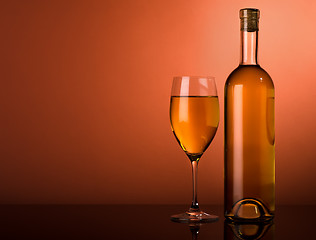 Image showing White wine on a brown background