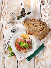 Image showing Bacon and bread on a wooden table