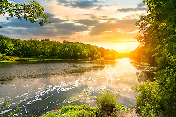 Image showing Sunset over the river in the forest