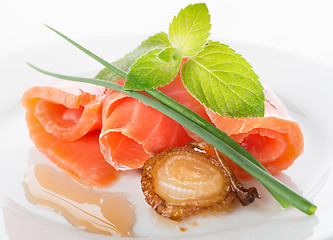 Image showing Salmon rolls with greens and fried onion