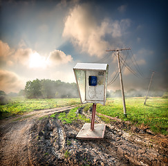 Image showing Old payphone in the field