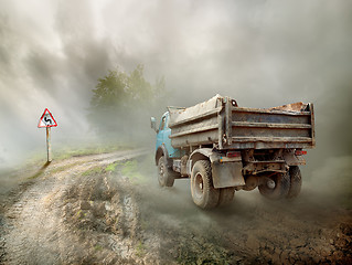 Image showing Dirty truck on a country road