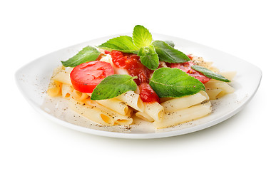 Image showing Pasta with ketchup and greens