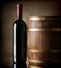 Image showing Bottle and wooden barrel