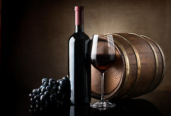 Image showing Red wine and wooden barrel