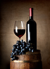 Image showing Red wine with barrel and grapes