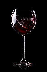 Image showing Wave of wine in wineglass