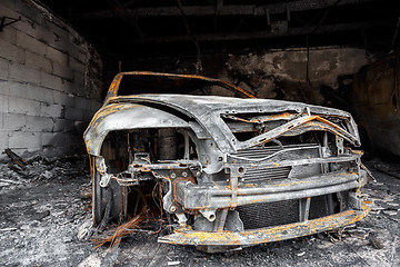 Image showing Close up photo of a burned out car