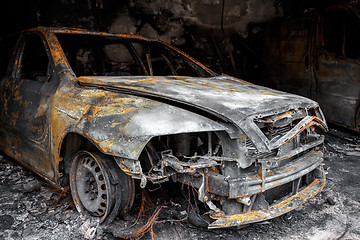 Image showing Close up photo of a burned out car