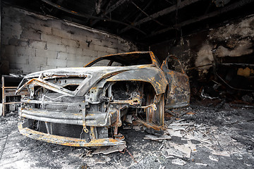 Image showing Close up photo of a burned out car