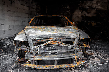 Image showing Close up photo of a burned out car