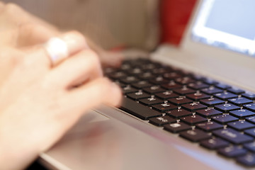 Image showing Young woman working on laptop