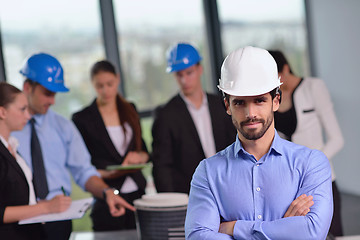 Image showing business people and engineers on meeting