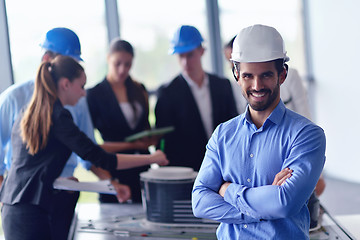 Image showing business people and engineers on meeting