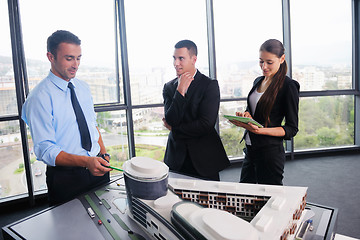 Image showing business people and engineers on meeting