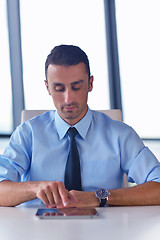 Image showing business man using tablet compuer at office